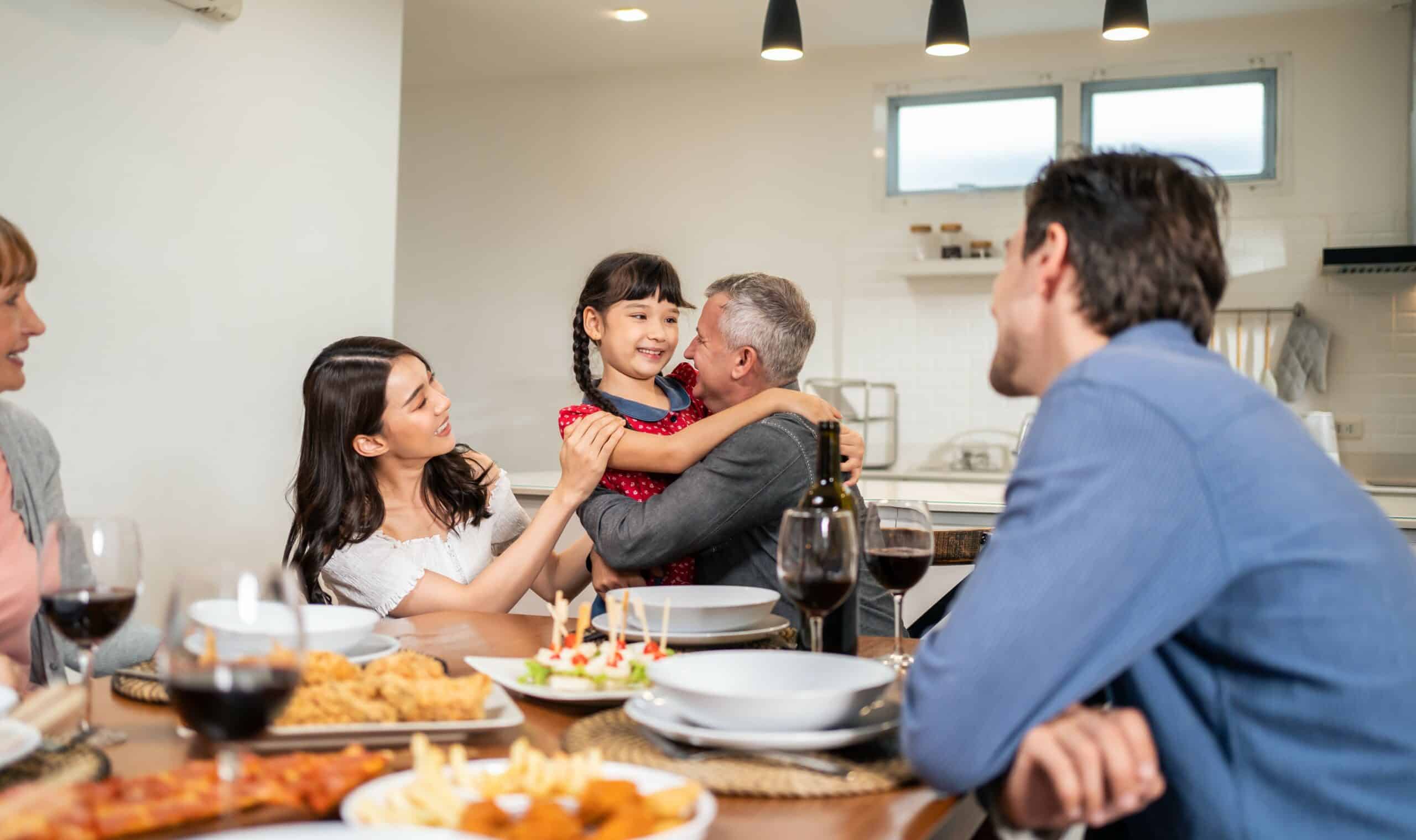 young couple and adorable daughter visit family